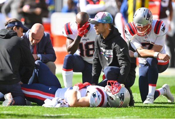 Dr. Nascimento attending to a New England Patriots player